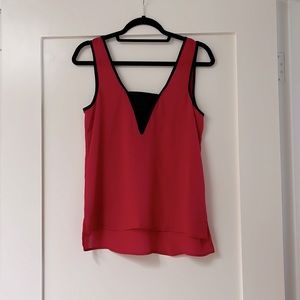 Socialite deep V sleeveless blouse. Color red with black accents, size S
